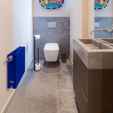 How does bathroom humidity affect radiator installation